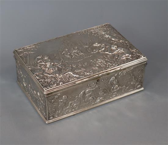 A 20th century white metal rectangular box, decorated with figures at various pursuits, 17.1cm.